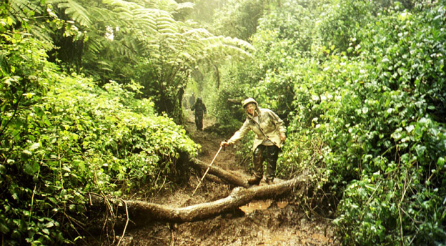 Laura testing out the deep mud on the last day of the Kili trek