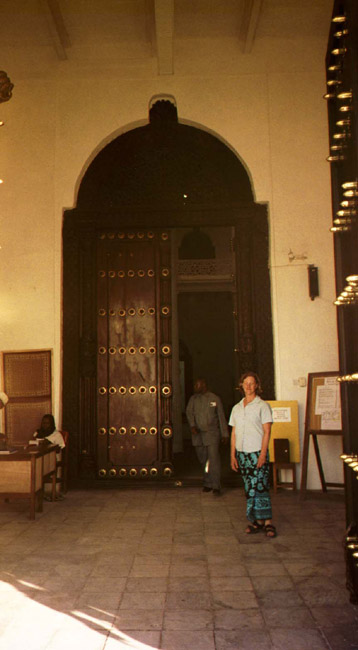 In front of the museum, with a side view of the elephant doors